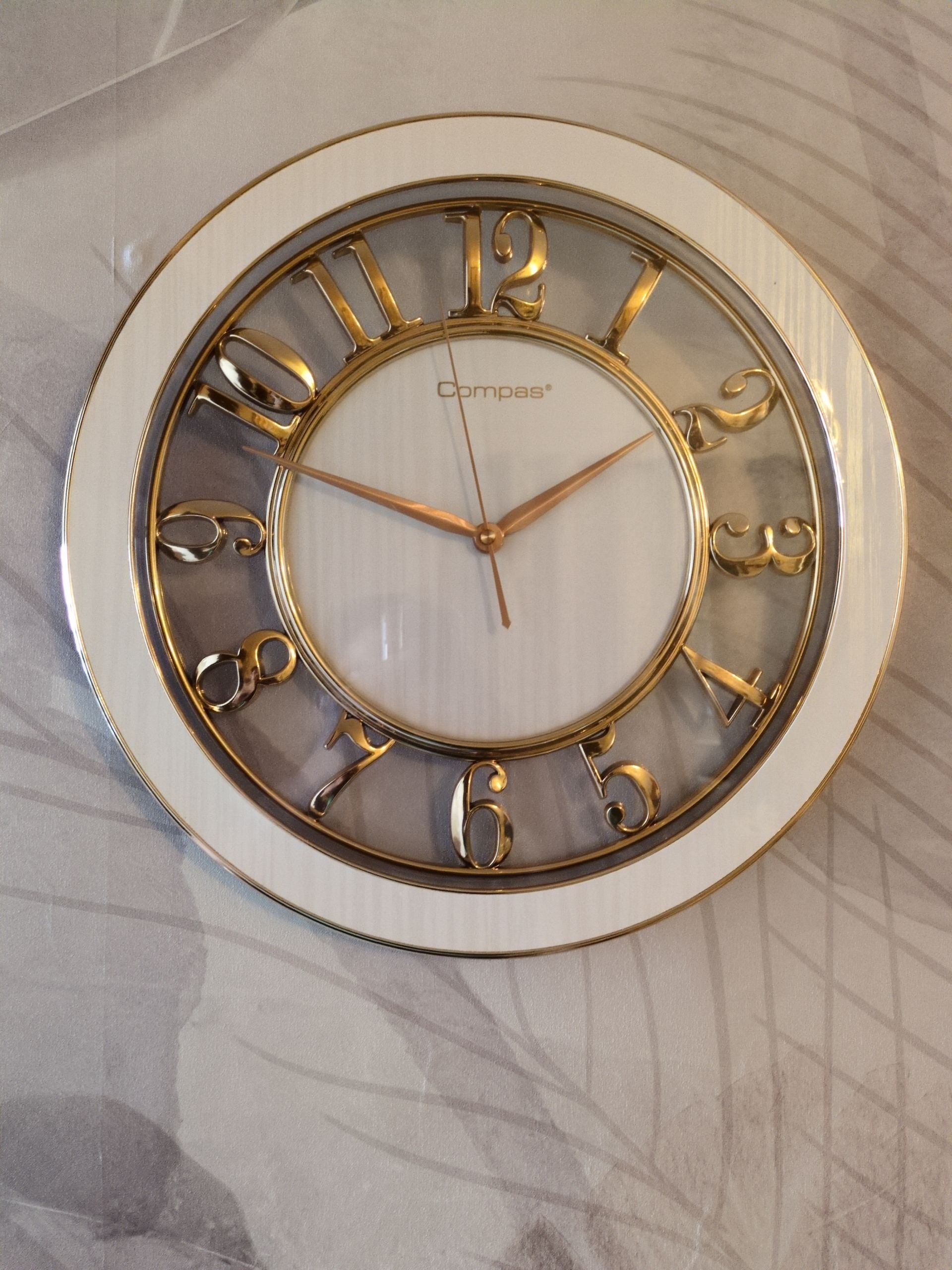 Modern Luxury Wall Clock – Gold Accents with Transparent Frame