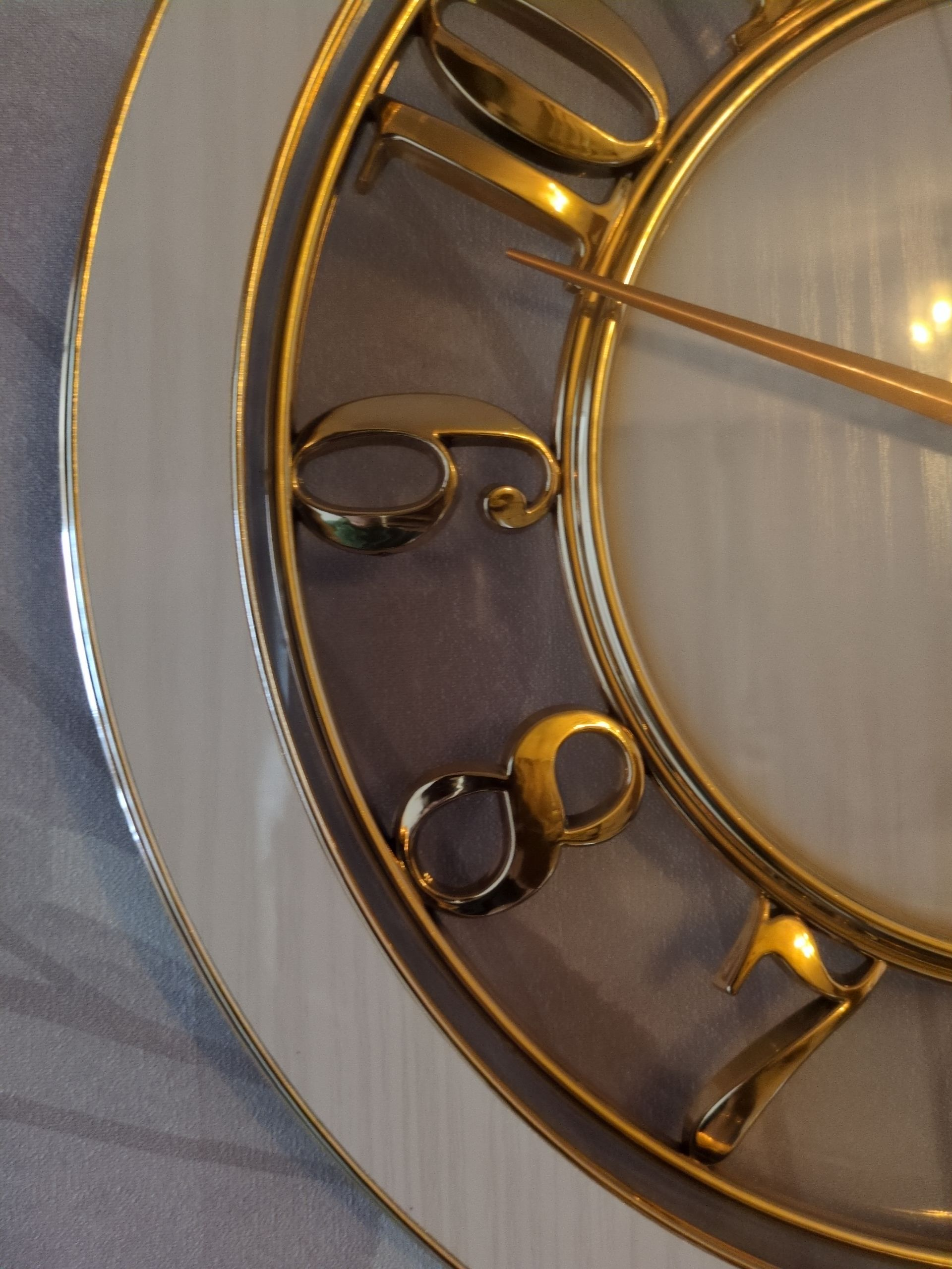 Modern Luxury Wall Clock – Gold Accents with Transparent Frame